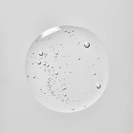 A droplet of Young Goose Bio-Barrier to show product texture centered on a solid light gray background.