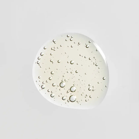 A glossy, translucent droplet of Young Goose Bio-Retinol, centered on a solid light gray background.
