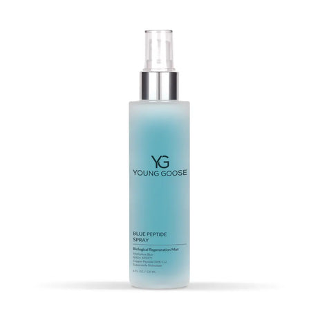 A bottle of Young Goose Blue Peptide Spray with a frosted light blue body, a silver pump collar, and a clear spray top, shown on a white background.