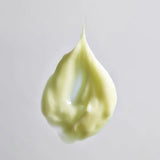 A dollop of Young Goose Youth Daily product texture on a light gray background.