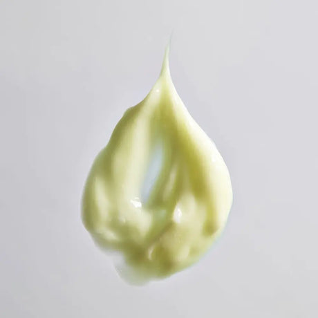 A dollop of Young Goose Youth Daily product texture on a light gray background.