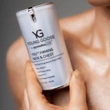 Young Goose Youth Firming Neck and Chest close up of bottle on a model skin