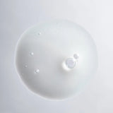 A single droplet of Young Goose Youth Reset centered on a clean light gray background.